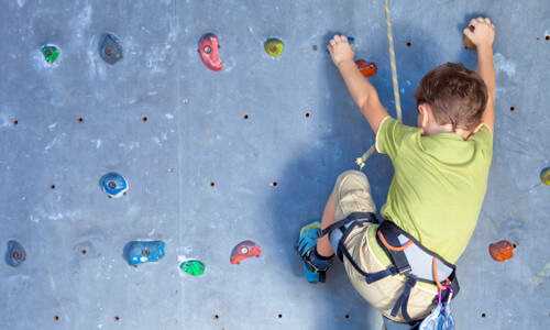 child climbing wall